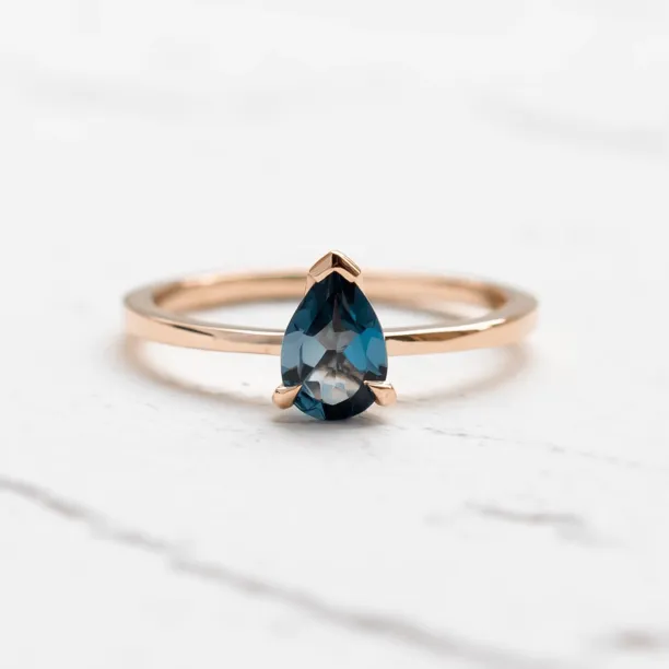 Gold ring with London blue topaz DROP