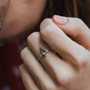 VALENTINO engagement ring with a kite-shaped salt'n'pepper diamond worn on a finger