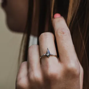 VALENTINO engagement ring with a kite-shaped salt'n'pepper diamond worn on the hand