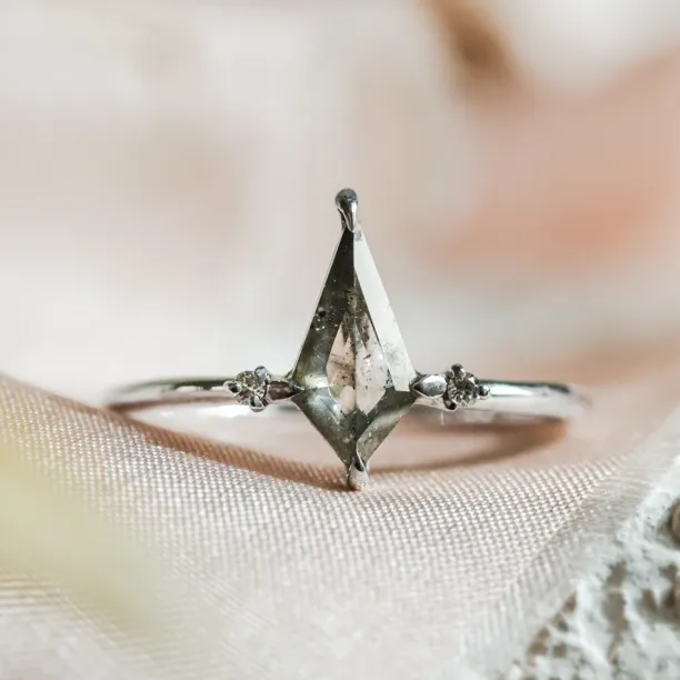 VALENTINO gold engagement ring with a kite-shaped salt'n'pepper diamond and two round diamonds