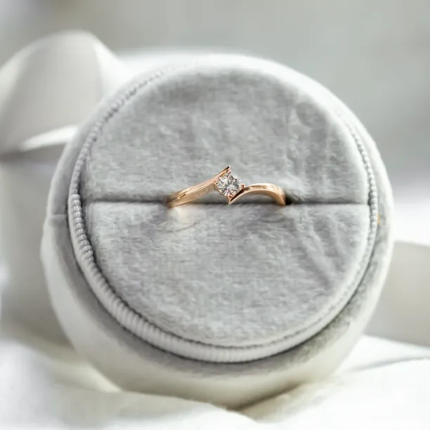 Gold engagement ring with lab-grown diamond shown from above