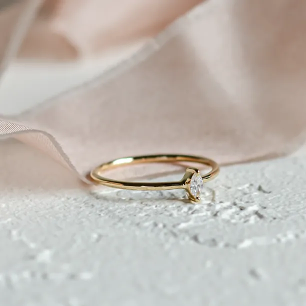 Angled view of the ANTOINETTA engagement ring with a marquise diamond
