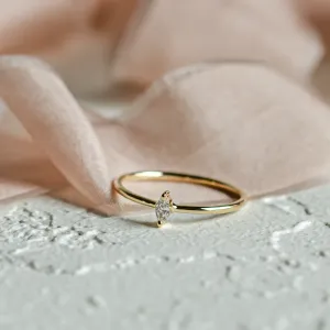 Close-up of the yellow gold ANTOINETTA engagement ring with a marquise diamond
