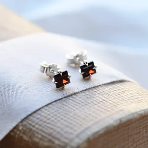 Angled view of GARNI gold garnet earrings