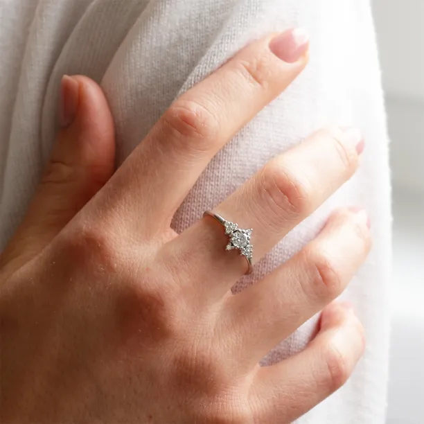 POMPADOUR diamond engagement ring worn on a hand