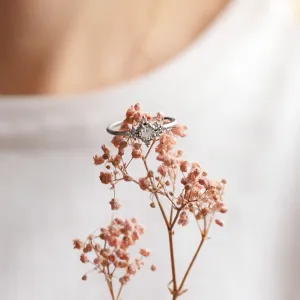 POMPADOUR diamond engagement ring displayed on dried flowers