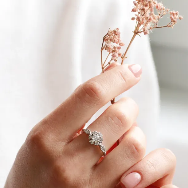 Gold vintage diamond ring CALYPSO worn on a hand in close-up