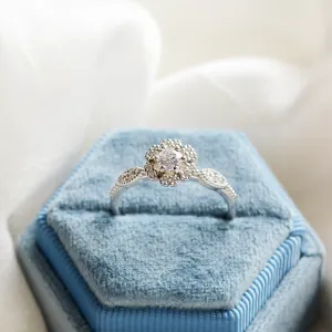 CALYPSO gold vintage diamond ring with a central diamond and surrounding stones