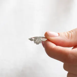 CALYPSO vintage diamond ring held between fingers