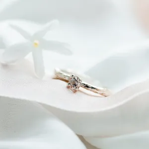 Angled close-up of the gold branch ring with morganite