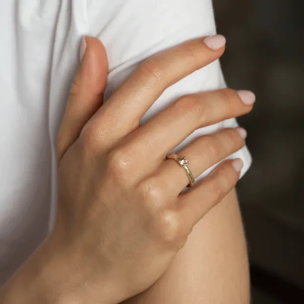 Gold branch ring with morganite worn on a hand