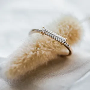 Close-up of the baguette moissanite and diamonds on the CASSIA engagement ring