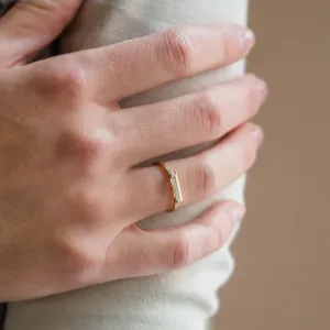 Angled view of the CASSIA engagement ring with baguette moissanite worn on the hand