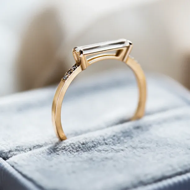 Side detail of the CASSIA engagement ring with baguette moissanite and diamonds