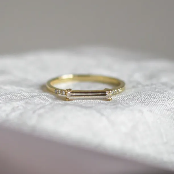 CASSIA engagement ring with baguette moissanite and diamonds in yellow gold