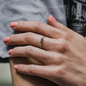 CASSIA engagement ring with baguette moissanite and diamonds worn on a hand