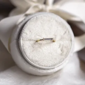 Close-up of CASSIA engagement ring with baguette moissanite and diamonds
