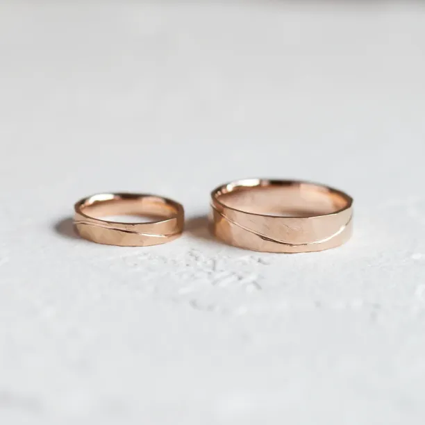 LIDO gold hammered wedding rings with a line, shown as a pair