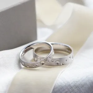 SELENE unusual space moon wedding bands with crater-like perforations