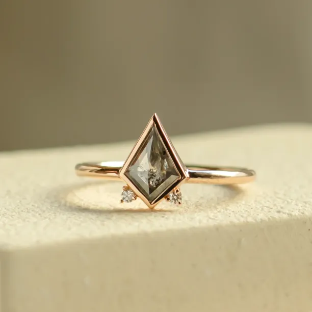 Close-up of CATKIN ring with kite salt and pepper diamond and side diamonds