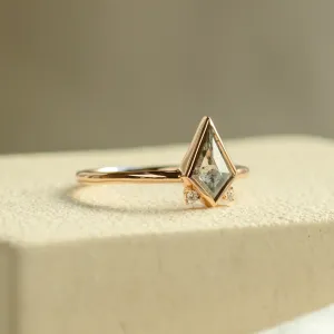 Angled view of the CATKIN gold ring with kite salt and pepper diamond and side diamonds
