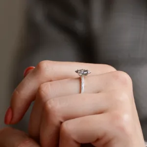 Side view of the ESTER gold ring with kite rutilated quartz worn on a finger