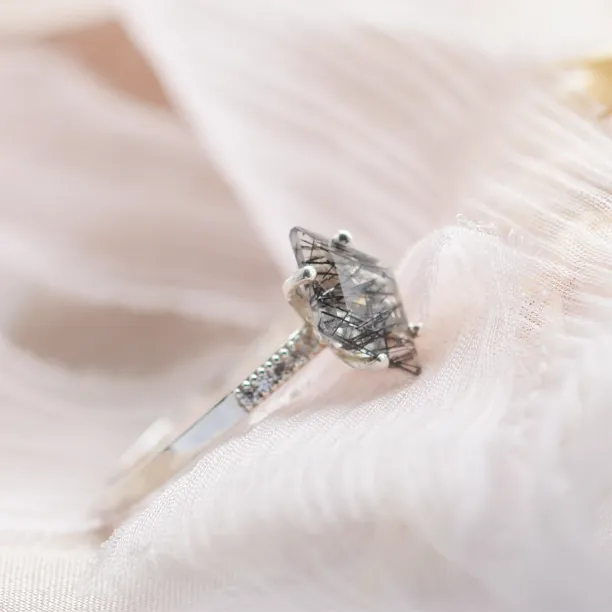 Close-up of the kite rutilated quartz and diamonds on the ESTER gold ring