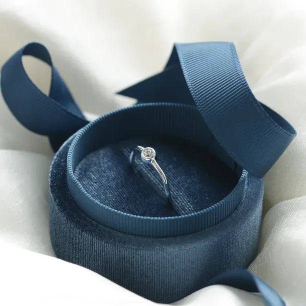 NOLLAIG diamond engagement ring shown from an angled side view