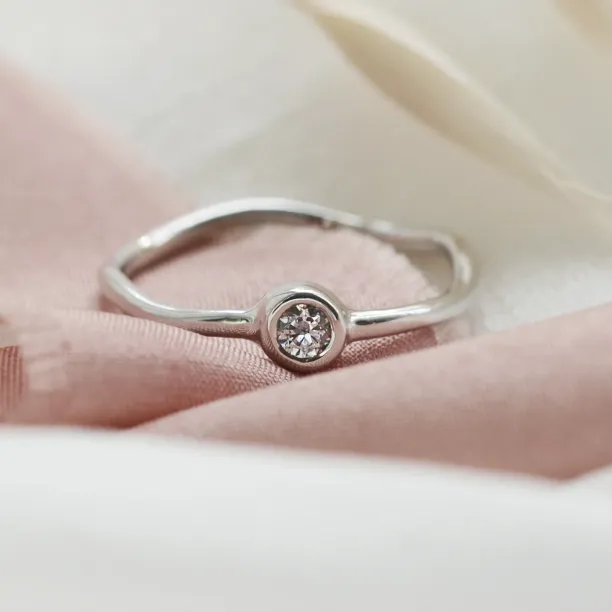 NOLLAIG minimalist engagement ring with diamond in a bezel setting