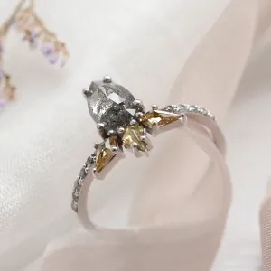 Angled close-up of the CROWNIA gold ring’s salt’n’pepper and fancy diamonds