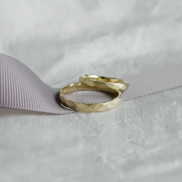 Matte gold wedding bands with hammered surface ETAIN Image