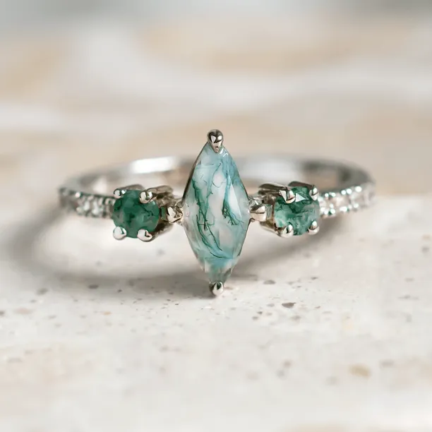 Vintage solid gold OSCAR ring with a marquise moss agate, round moss agates and side diamonds