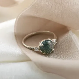 Angled view of the FIONNUALA gold ring with moss agate and diamonds