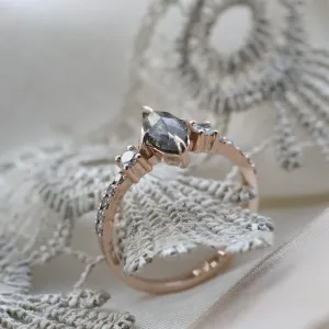 Angled close-up of the ROISIN ring showing its marquise diamond and detailed setting