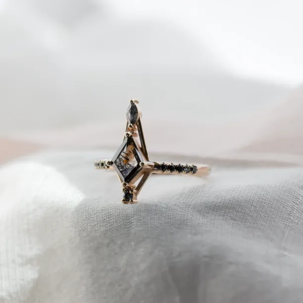 Angled close-up of SANIA ring with kite-shaped and marquise salt and pepper diamonds