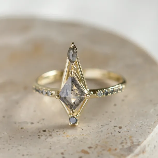Close-up of SANIA ring with kite-shaped centerpiece, marquise diamond and diamond-set band