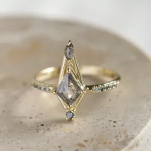 Close-up of SANIA ring with kite-shaped centerpiece, marquise diamond and diamond-set band