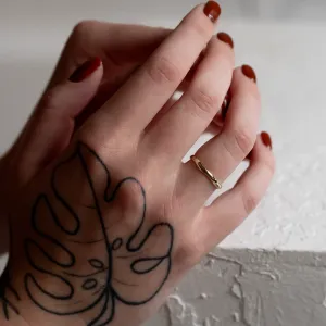 LUANA irregular gold wedding ring worn on a hand