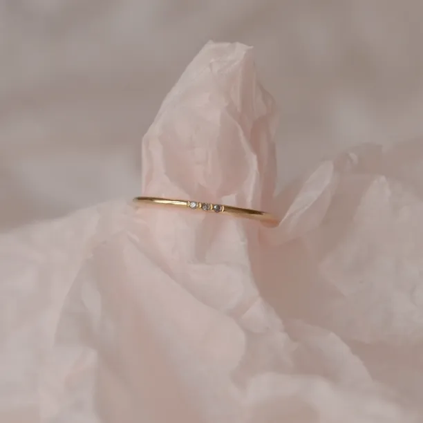Gold minimalist ring with salt and pepper diamonds OLU Image