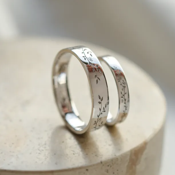 Gold wedding rings with plant motif MIKA Image