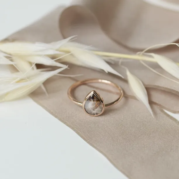 Gold XENA ring with a rounded teardrop-shaped salt and pepper diamond