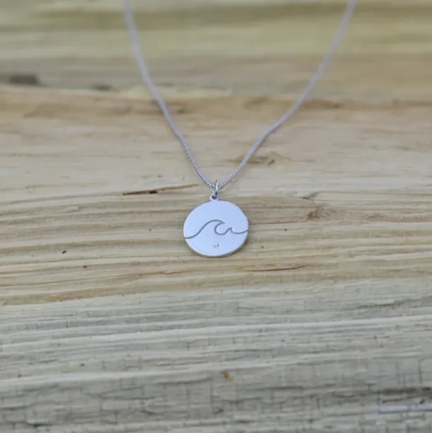 Silver pendant with a diamond SURF Image