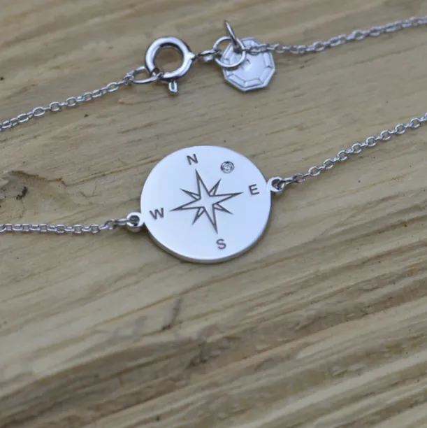 Gold bracelet with a compass and a diamond BOBBIE Image