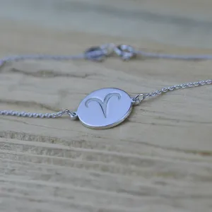 Close-up of ZOD zodiac bracelet with an Aries symbol