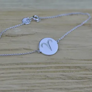 Angled view of ZOD zodiac bracelet with an Aries symbol
