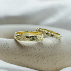 DRIS yellow gold wedding rings with tree-inspired textured bands