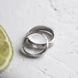 DRIS gold wedding rings shown from an angle with their interiors visible