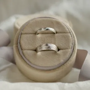 DRIS gold wedding rings presented together in an angled view