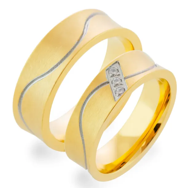 Close-up of LORI matte gold diamond wedding rings with three diamonds