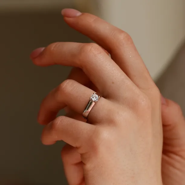 HEIM silver ring with zircon worn on a hand, angled view
